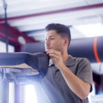 Young man working in a upholstery workshop